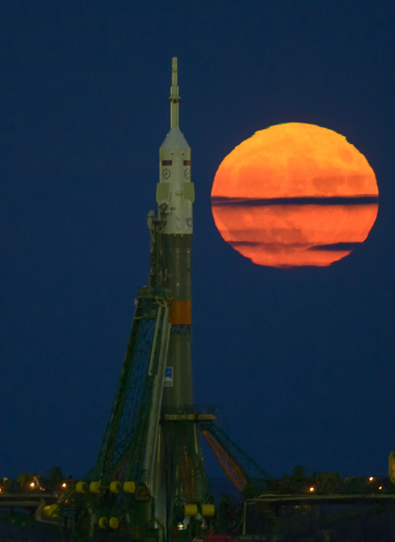 The Moon, or supermoon, is seen rising behind the Soyuz rocket at the Baikonur Cosmodrome launch pad in Kazakhstan, Monday, Nov. 14, 2016. NASA astronaut Peggy Whitson, Russian cosmonaut Oleg Novitskiy of Roscosmos, and ESA astronaut Thomas Pesquet will launch from the Baikonur Cosmodrome in Kazakhstan the morning of November 18 (Kazakh time.) All three will spend approximately six months on the orbital complex.  A supermoon occurs when the moon’s orbit is closest (perigee) to Earth. Photo Credit: (NASA/Bill Ingalls)